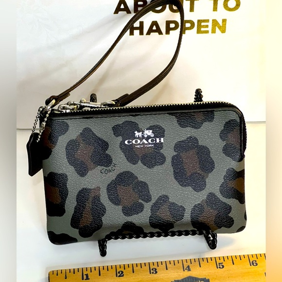 Coach Handbags - Coach Animal Print Wristlet EUC